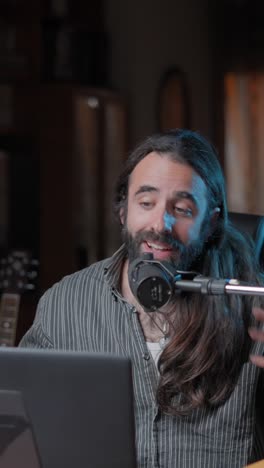 man recording a podcast or live stream from his home studio