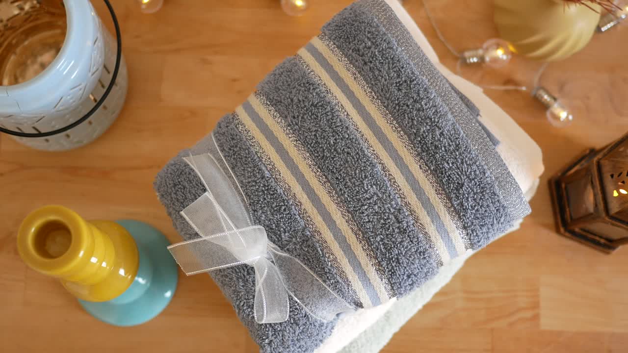 Stack of Striped Towels with a Bow