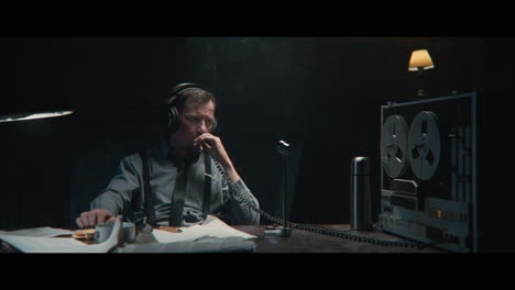an intelligence officer listens to the wiretap recordings