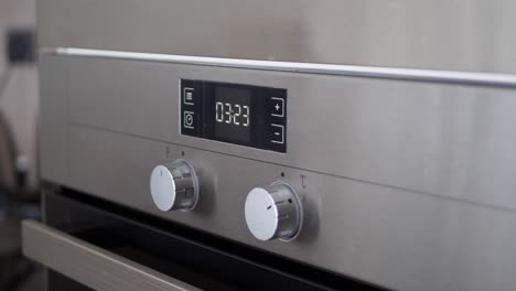 close-up of modern stainless steel oven controls