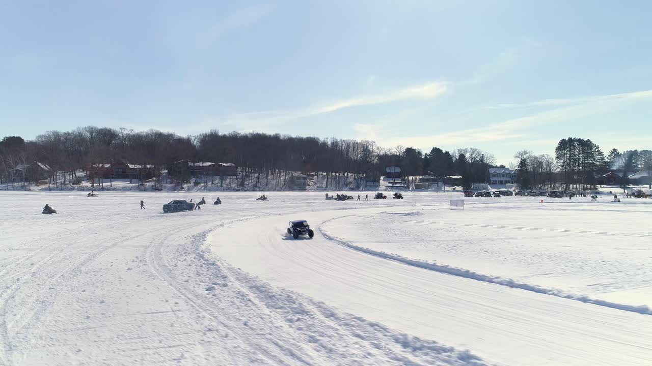 Specially engineered utility vehicles race around a dangerously icy circuit