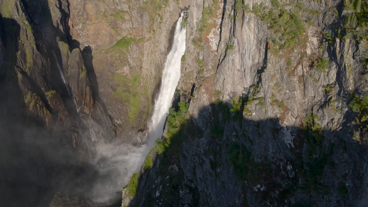Aerial View Of Voringfossen Waterfall With Rainbow On A Sunny Day In Norway. - reveal