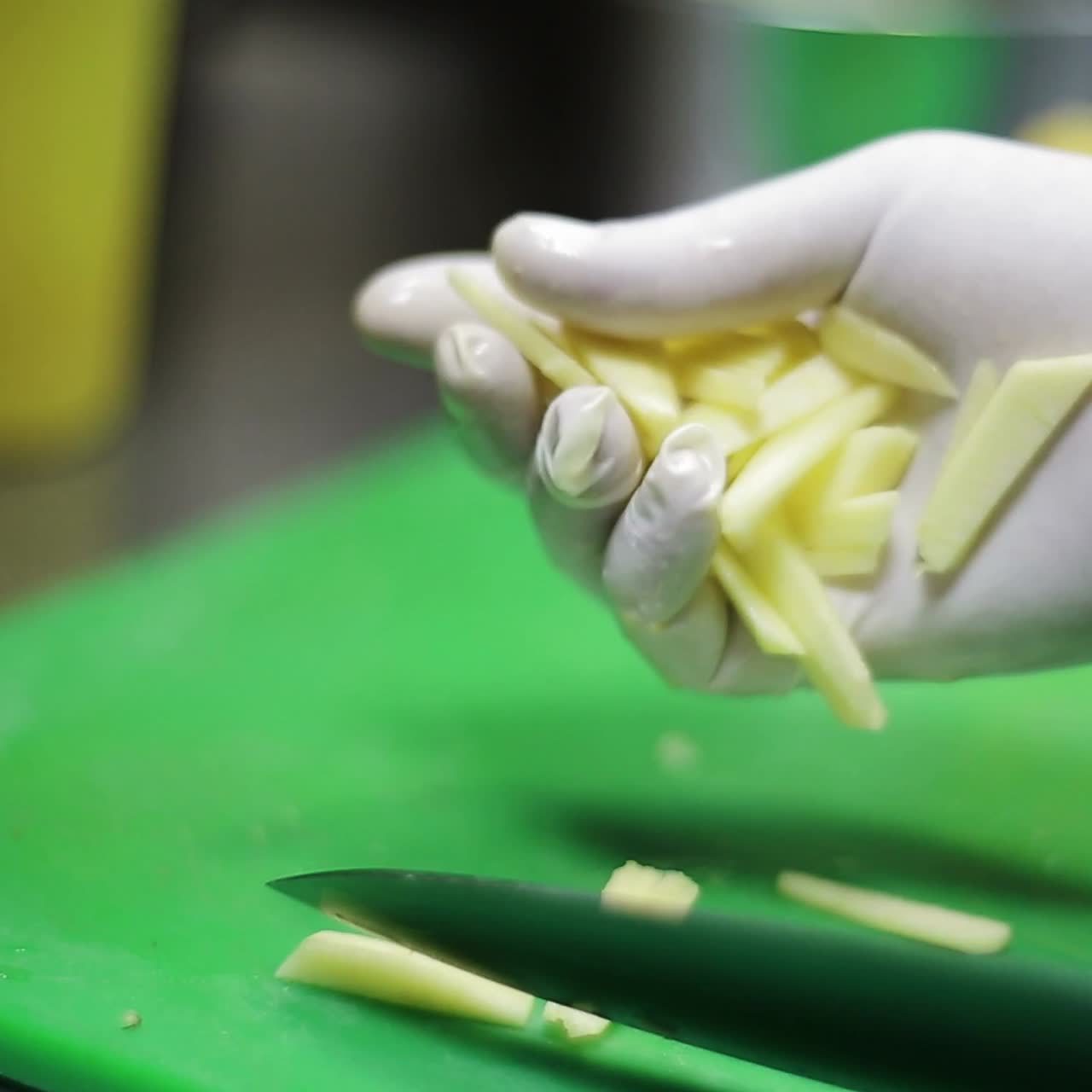 Hand Cutting The Potatoes In The Kitchen