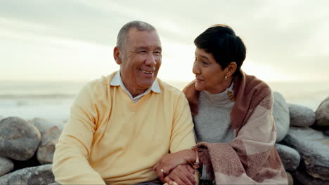 senior couple, love and talking at the beach
