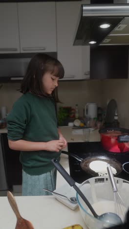 girl making pancakes