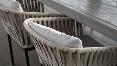 outdoor dining chairs with beige cushions