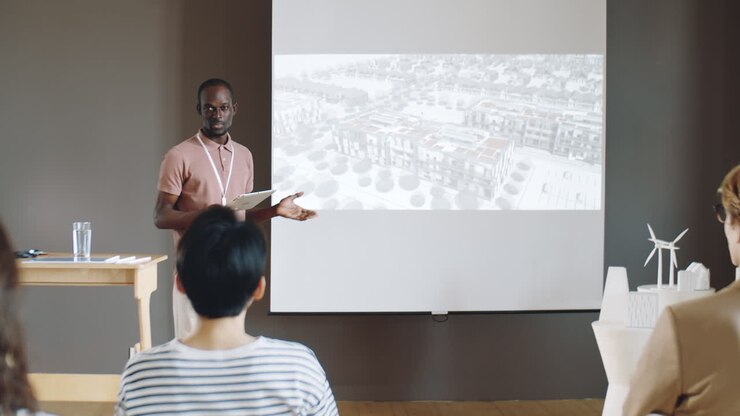 African American Architect Giving Presentation on Conference