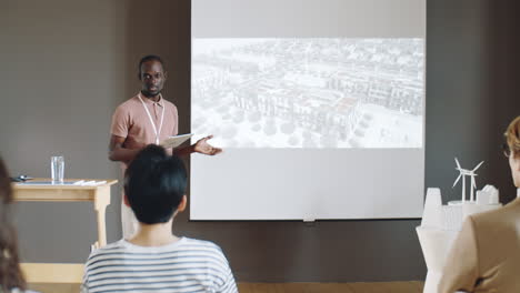 african american architect giving presentation on conference