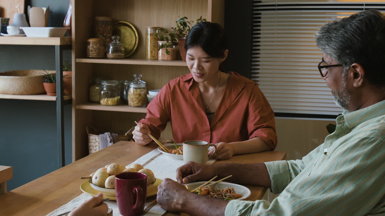 Happy Family Enjoying a Meal Together at Home