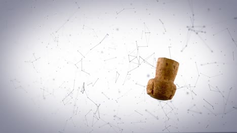 Network-of-connections-floating-over-wine-cork-falling-against-grey-background