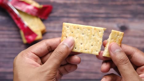 person holding a cracker