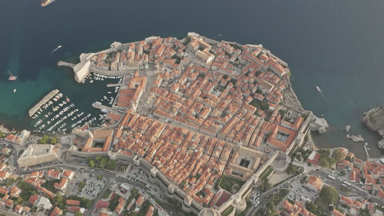 Top down view of the entire Old Town in Dubrovnik, Croatia with port, boats and ocean view.
