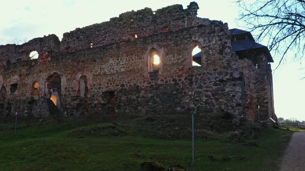 Sunlight Passing Through Window Of Rauna Castle Ruins In Rauna, Latvia. - zoom in