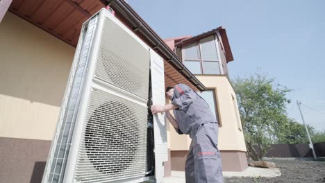 hvac technician installs heating, ventilation and air conditioning systems. heat pump