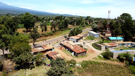 Aerial-drone-view-Open-Air-market-in-the-Loitokitok-town,-Kenya-and-mount-Kilimanjaro--Rural-village-of-Kenya