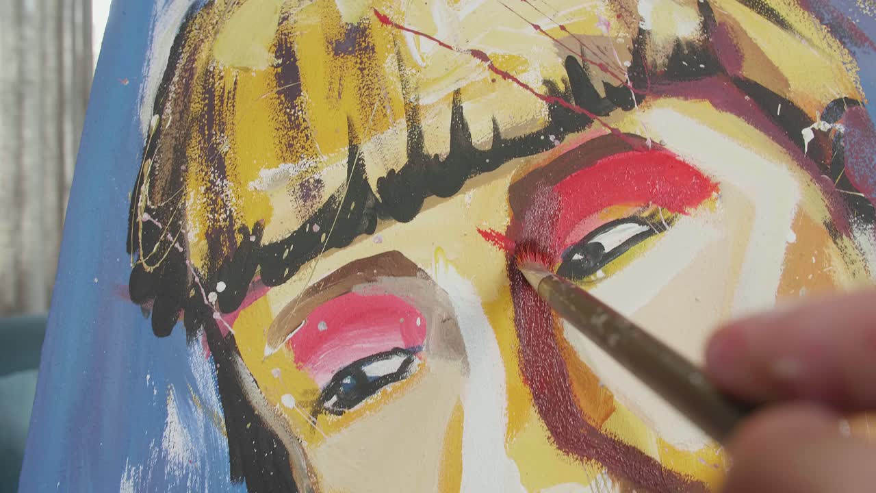 Close Up Of A Hand Holding Paintbrush Mixed Colour And Painting A Girl'S Nose On The Canvas