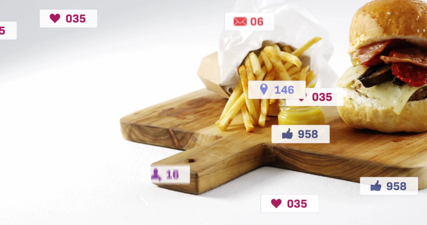 Badges appearing, floating and clustering to burger and fries on board, showing social engagement