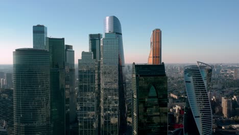 moscow city business centre buildings pan shot, on background of blue sky