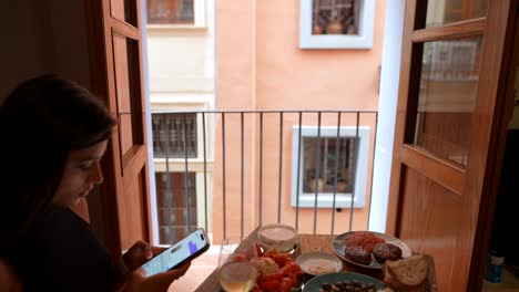 woman eating lunch with a view of the city