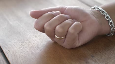 woman´s hand catching silver coin