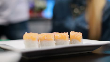 making sushi, japanese food. chef with a plate of sushi, making sushi, japanese food