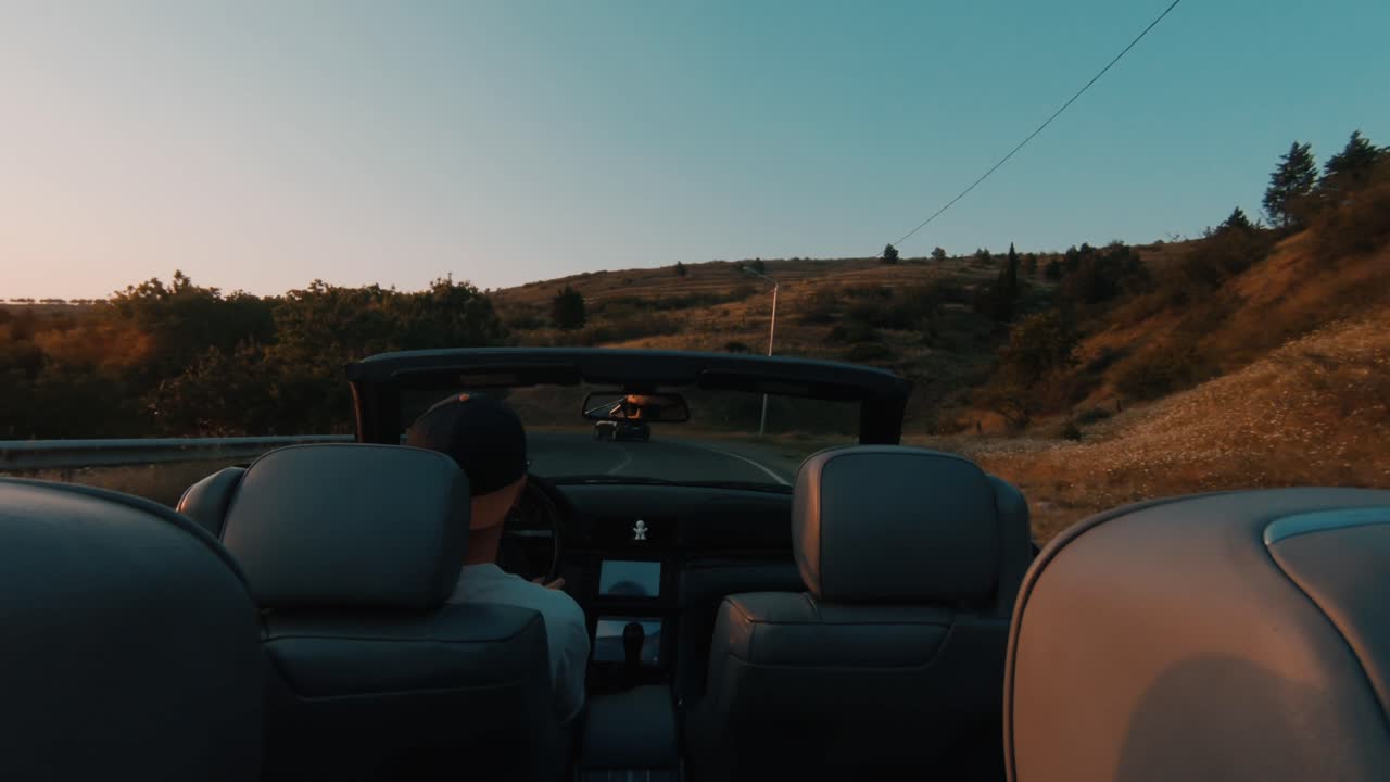 BMW E46 convertible driving near the sea