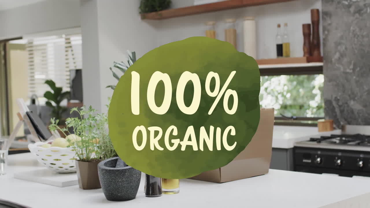 100% organic text animation over modern kitchen with plants and cooking utensils