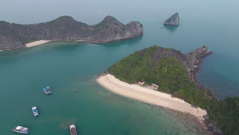 Drone-View-of-Ha-Long-Bay,-Lan-Ha-Bay-in-Vietnam-among-islands-of-Karst-Mountains-and-empty-beaches