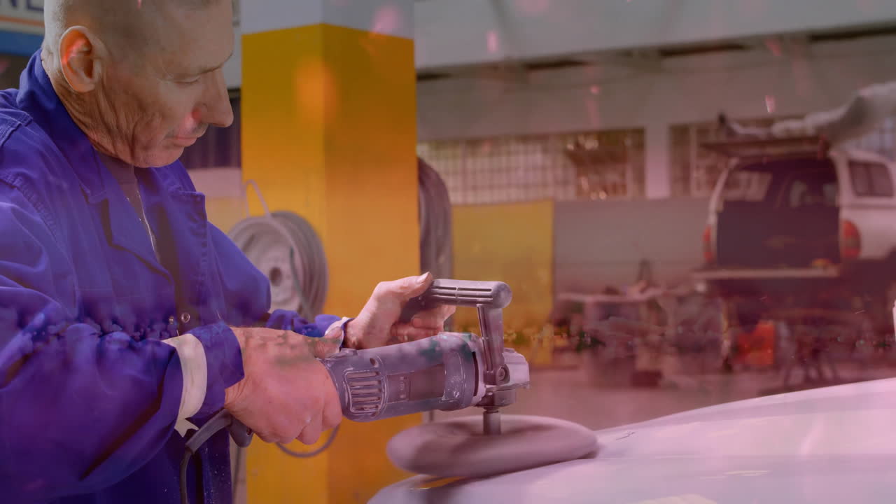 Mechanic using electric buffer on car hood in automotive repair workshop, with floating tool icons