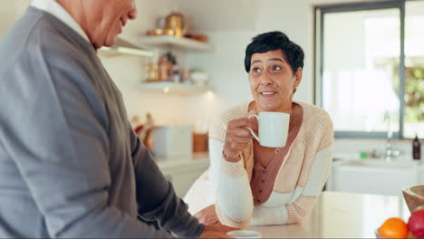 Senior-couple,-talk-in-kitchen-with-coffee