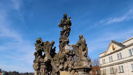 statues of madonna and saint bernard on charles bridge in prague, czech republic