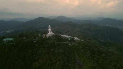 giant buddha statue on mountaintop in thailand