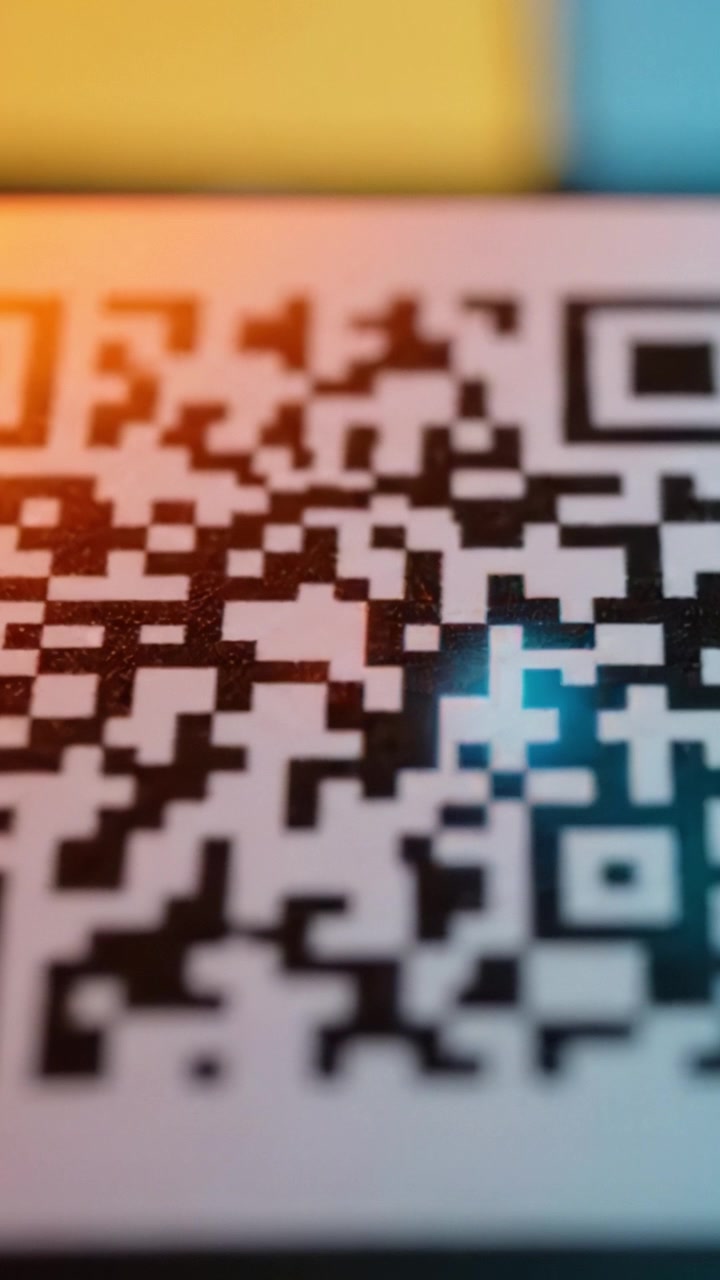 Close-Up of a QR Code Highlighting Its Unique Patterns and Details in a Colorful Background, Showcasing Modern Technology and Digital Interaction Possibilities