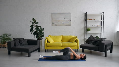 Woman Doing Stretching Exercises at Home