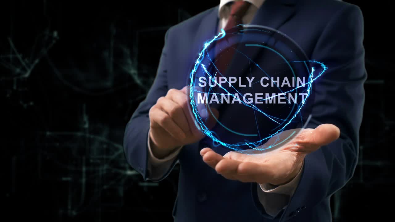 Businessman shows concept hologram Supply Chain Management