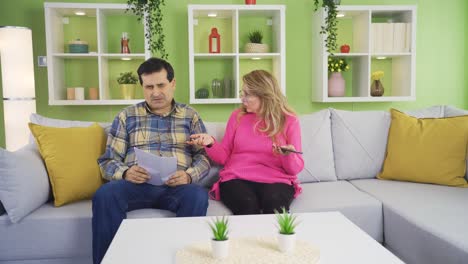 the man, who learns that his house will be foreclosed, is devastated and sad and shares the news with his wife.