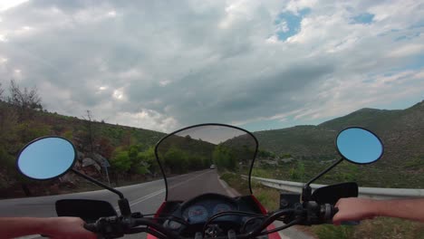 riding a motorcycle on penteli mountain in greece