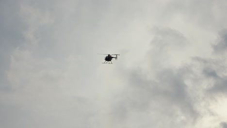 helicopter flying by overhead in slow motion