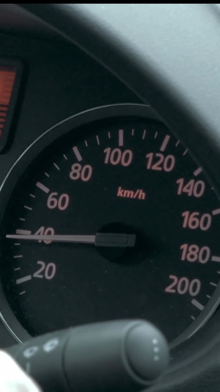 Car speedometer showing speed in km/h