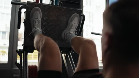 man doing leg press at the gym