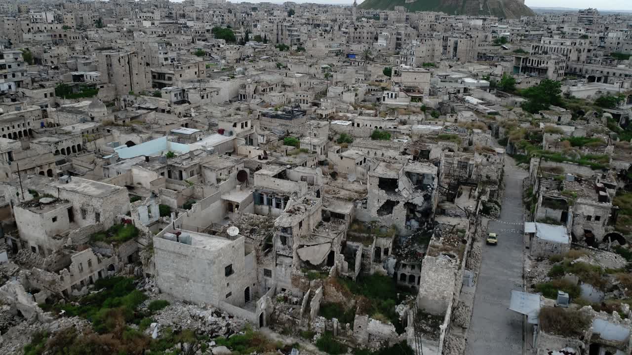 Aleppo in Syria under the sunlight. We can see the city all over the horizon - aerial view with a drone 4K
