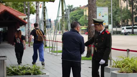 soldier and civilian exchange items on the street