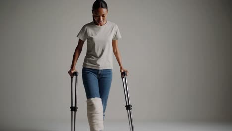 woman with a leg cast using crutches