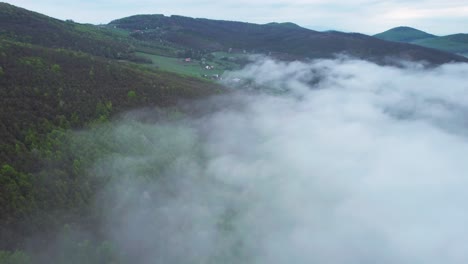 Arial-shot-of-a-cloud-wall-covering-the-base-valley-of-the-Tatras-Mountains,-Slovakia