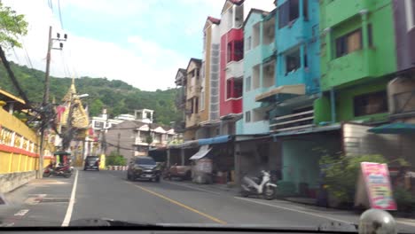 view from the cab of the car on the city road.