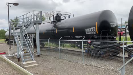 slow pan showing the multiple tankers of fuel to be offloaded