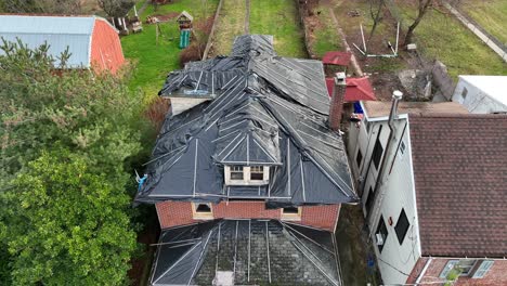 aerial rising shot of an abandoned family home in rural america