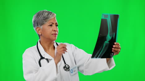 X-ray,-green-screen-and-mature-doctor-analyzing