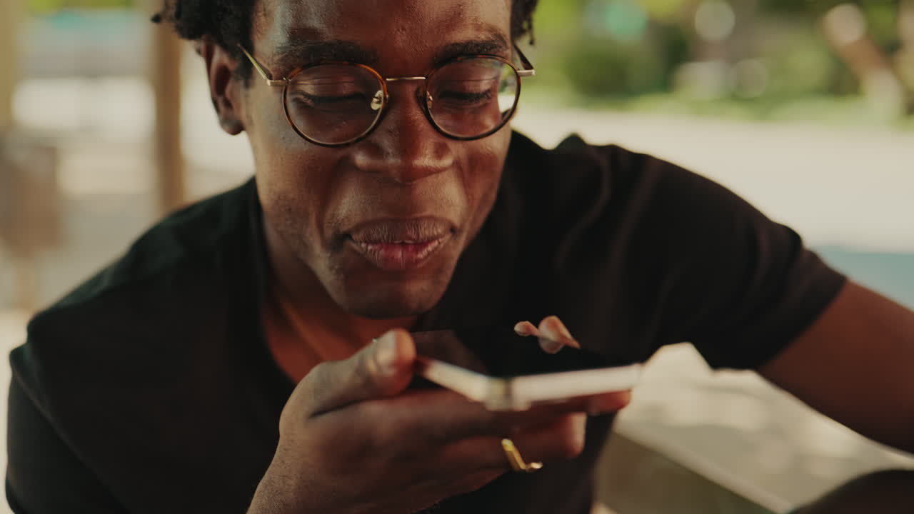 Happy African American Man Sending Voice Message on Phone