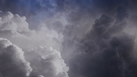 4k thunderstorm, flash of lightning within the thick clouds in the dark sky